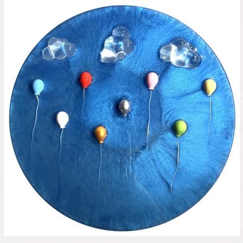 Round deep blue marbled panel with multicolored balloons and clear glass clouds
